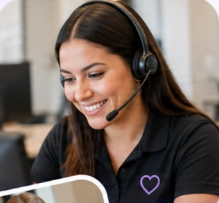 Smiling CareLink support specialist wearing a headset